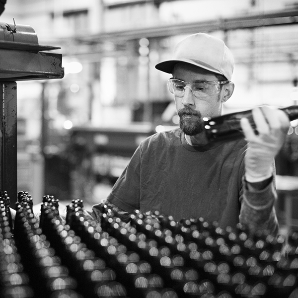Worker Working At Beer Manufacturing Industry